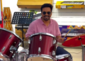 Pijush K.Roy trying a drum kit inside Swastik Sports & Musicals showroom in Raipur