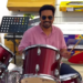 Pijush K.Roy trying a drum kit inside Swastik Sports & Musicals showroom in Raipur