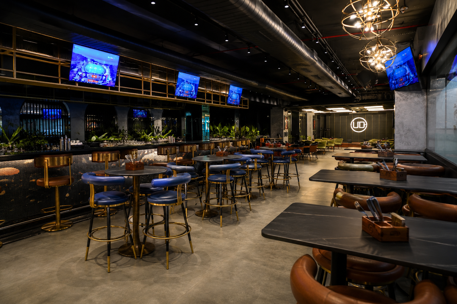 Underdoggs Raipur sports bar interior with large screens, bar seating and modern décor