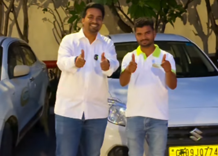 Pijush K. Roy with a driver standing beside a car during the UNTO ride-sharing app launch in Raipur